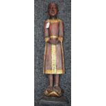 A wooden figure, standing Buddha,