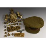 A World War II Royal Artillery Officer's Service Cap with bronze cap badge;