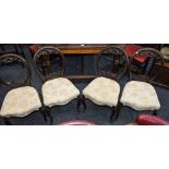 A set of four Victorian cartouche back dining chairs, c.