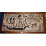 A textile wall hanging, depicting a historical Egyptian scene, framed, 76.5cm x 152.