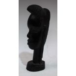 Tribal Art - a carved hardwood African bust, 23.