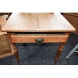 A Farmhouse pine kitchen table, rounded near-square top above a single frieze drawer,