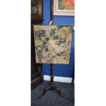 A '19th century' pole screen, rectangular tapestry screen, triform base,