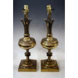 A pair of brass table lamps,