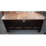 An 18th century oak chest, rectangular top above a four panel front,