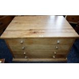 A low pine plan type chest, slightly oversailing rectangular top above four long drawers,