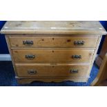 A Farmhouse pine chest, slightly oversailing top above three long graduated drawers, shaped base,