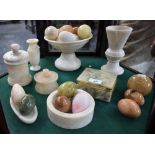 A quantity of polished stone eggs,