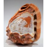 A carved shell cameo conch with lamp aperture,