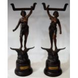 A pair of French spelter table screen figures, day and night, 32.