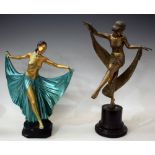 An Art Deco gilt and green coloured painted chalk figure of a topless dancing girl,
