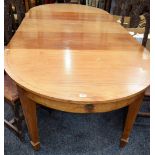 A large early 20th century mahogany extending dining table,
