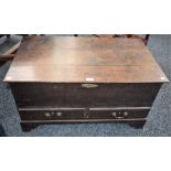 A late 18th century oak mule chest, hinged rectangular top above a pair of short drawers,