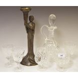 An Art Nouveau style figural candlestick; a cut glass decanter; two brandy glasses;