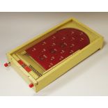 A Chad Valley miniature bagatelle board