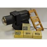 An Ensign Mickey Mouse magic lantern; Primus Junior Aladdin slides; Alice in Wonderland;