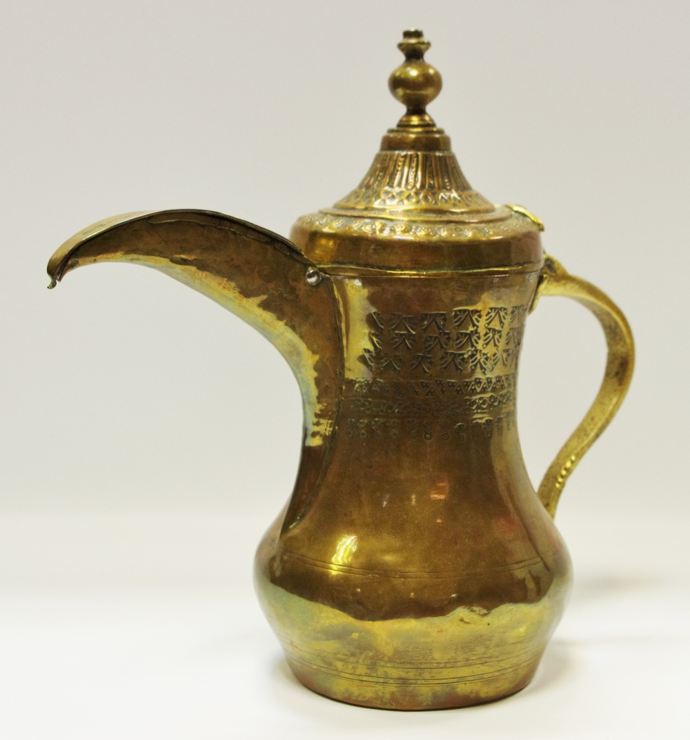 A 19th century brass Islamic Dallah coffee pot impressed decoration