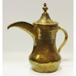 A 19th century brass Islamic Dallah coffee pot impressed decoration