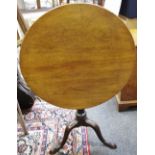 A George III mahogany tilt top table, circular top, turned baluster column, three cabriole legs,