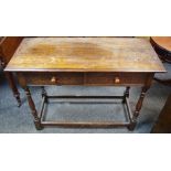 An oak hall table, moulded top, two short blind fretworked drawers to frieze, button handles,
