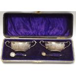 A pair of Edwardian silver half-fluted oval salts, Birmingham 1902,