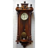 A late 19th century walnut Vienna wall clock,