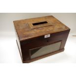 A 19th century mahogany ballot box, with post slot to cover, the front with glazed window,