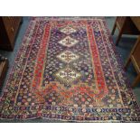 A hand woven Middle Eastern rug, geometric designs in taupe,