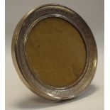 A Continental silver circular easel photograph frame,