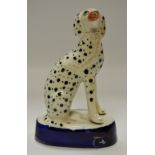 A Staffordshire Dalmation, seated,