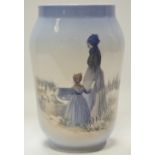 A Royal Copenhagen vase decorated with mother and daughter amongst sand dunes over looking the sea,