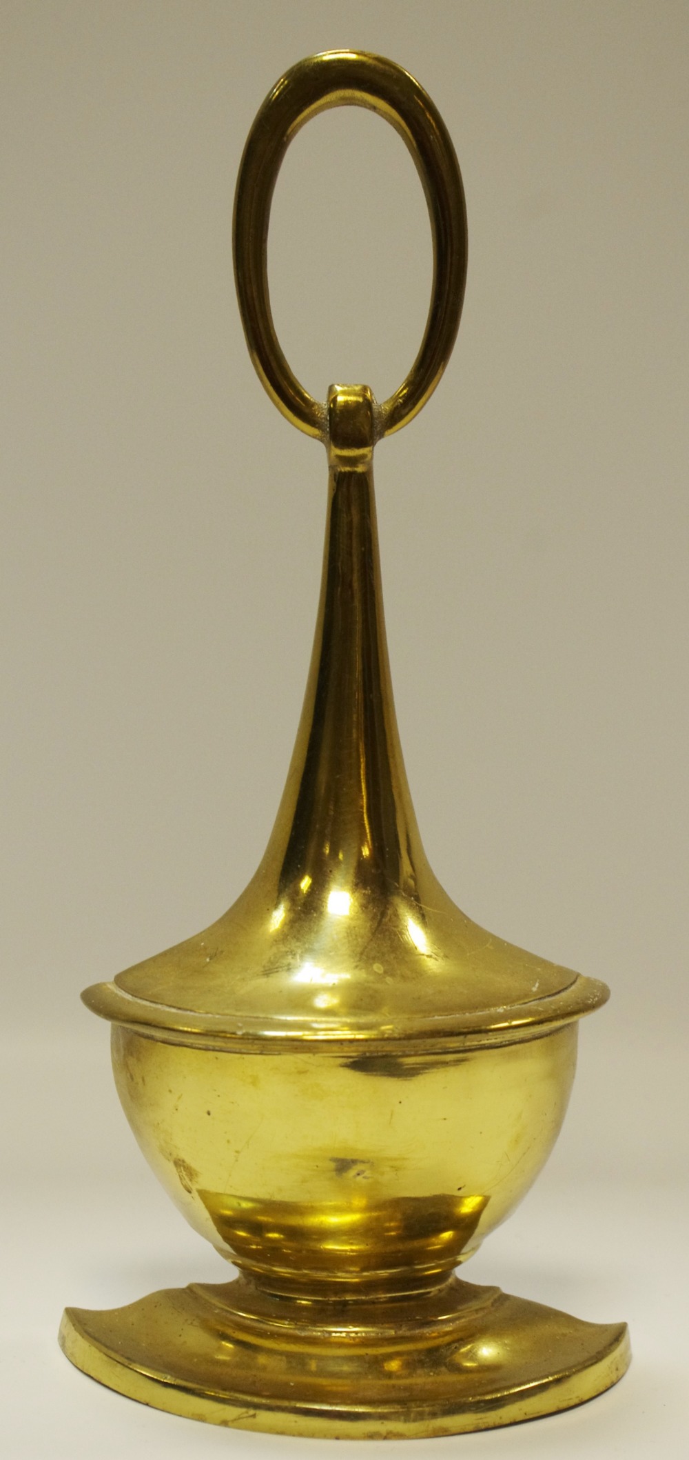 A Neo-Classical style brass urnular door stop