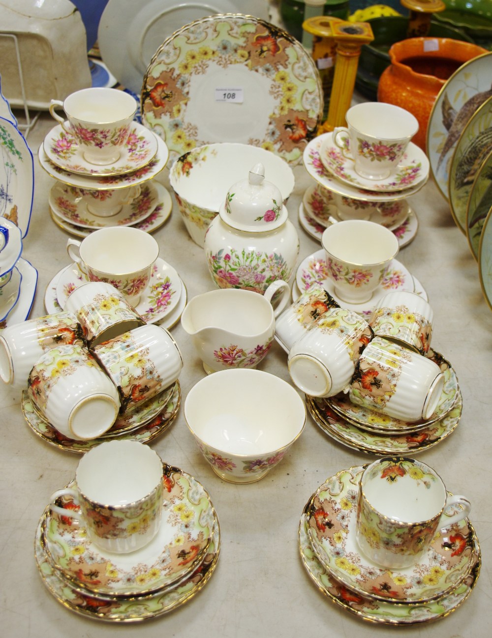 A Colclough D574 pattern tea service for six; a Staffordshire tea service, c.