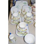 A Foley China part tea service for six, printed with a windmill in a landscape,