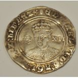 An Edward VI shilling Rose to the left XII to the right