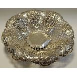 A late Victorian silver pedestal sweetmeat dish, pierced bowl decorated with four vacant cartouches,