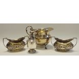 A silver creamer, Deykin & Harrison, Birmingham, 1932; a pair of Edwardian silver salts,