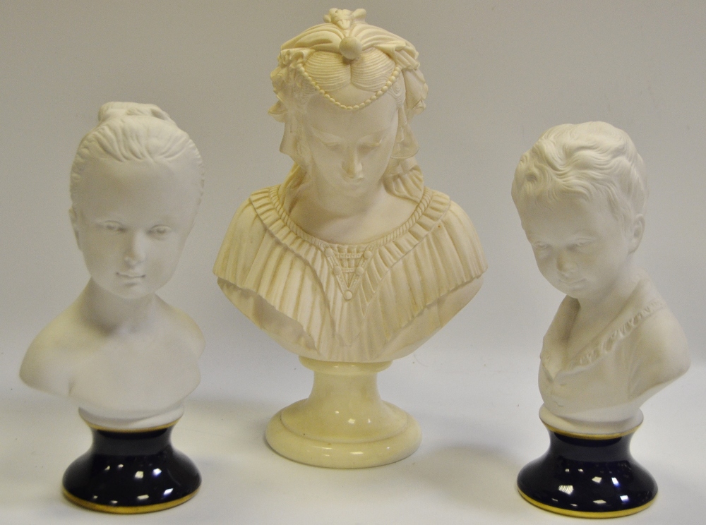 A pair of German Unter Weiss Bach busts, of a boy and girl, cobalt blue socles, 19cm high; after A.