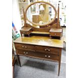 An Edwardian mahogany dressing chest, oval mirror and two drawers to top,