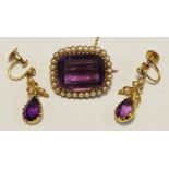 A 15ct gold & purple stone & seed pearl brooch;