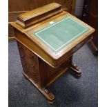 A walnut piano top davenport, by D R Baxter Kettering, leather inlaid slope,