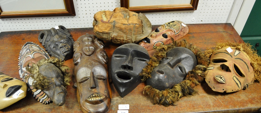 Tribal Art - six African masks including a carved ebony example;