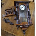 A mahogany cased Vienna type wall clock, architectural pediment crested by an eagle,