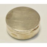 A George V silver circular pill box, hinged cover, gilt interior,