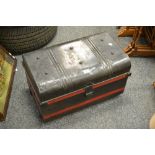 A dome topped tin trunk