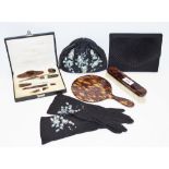 A faux tortoiseshell manicure set; a set of lady's gloves;