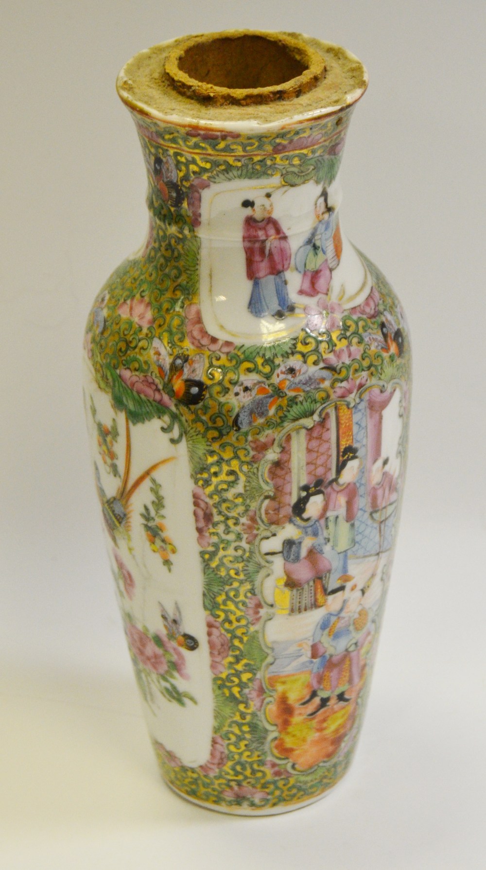 A 19th century Chinese baluster shaped vase decorated with figures amongst the palace walls,