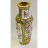 A 19th century Chinese baluster shaped vase decorated with figures amongst the palace walls,