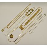 A Trifari frosted gold plated necklace and earring set; yellow metal necklaces;
