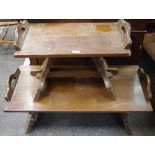 An oak coffee table , rectangular top with shaped handles,